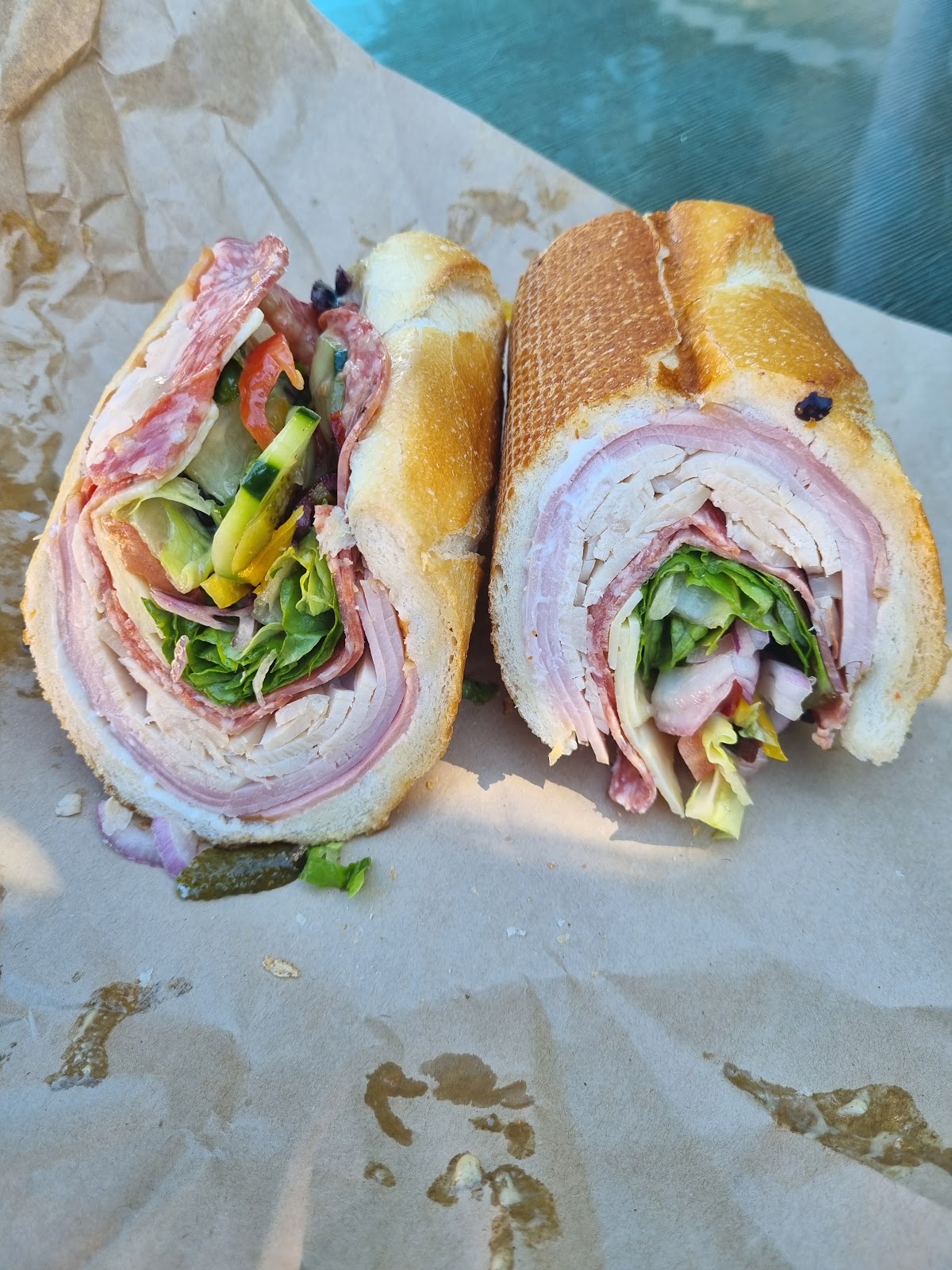 A turkey and salami sub cut in half
