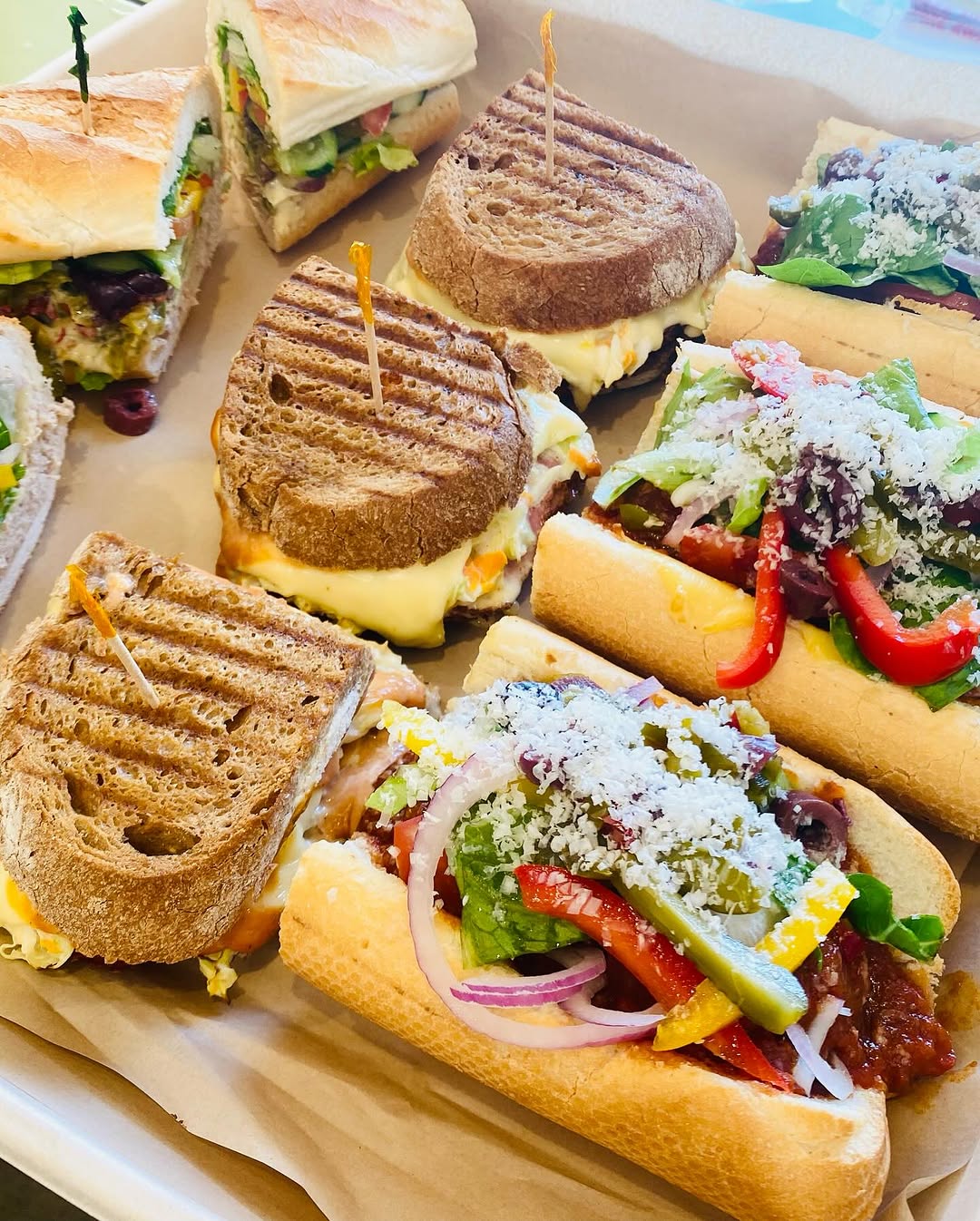 A spread of toasted rye paninis and loaded subs from Miami Subs